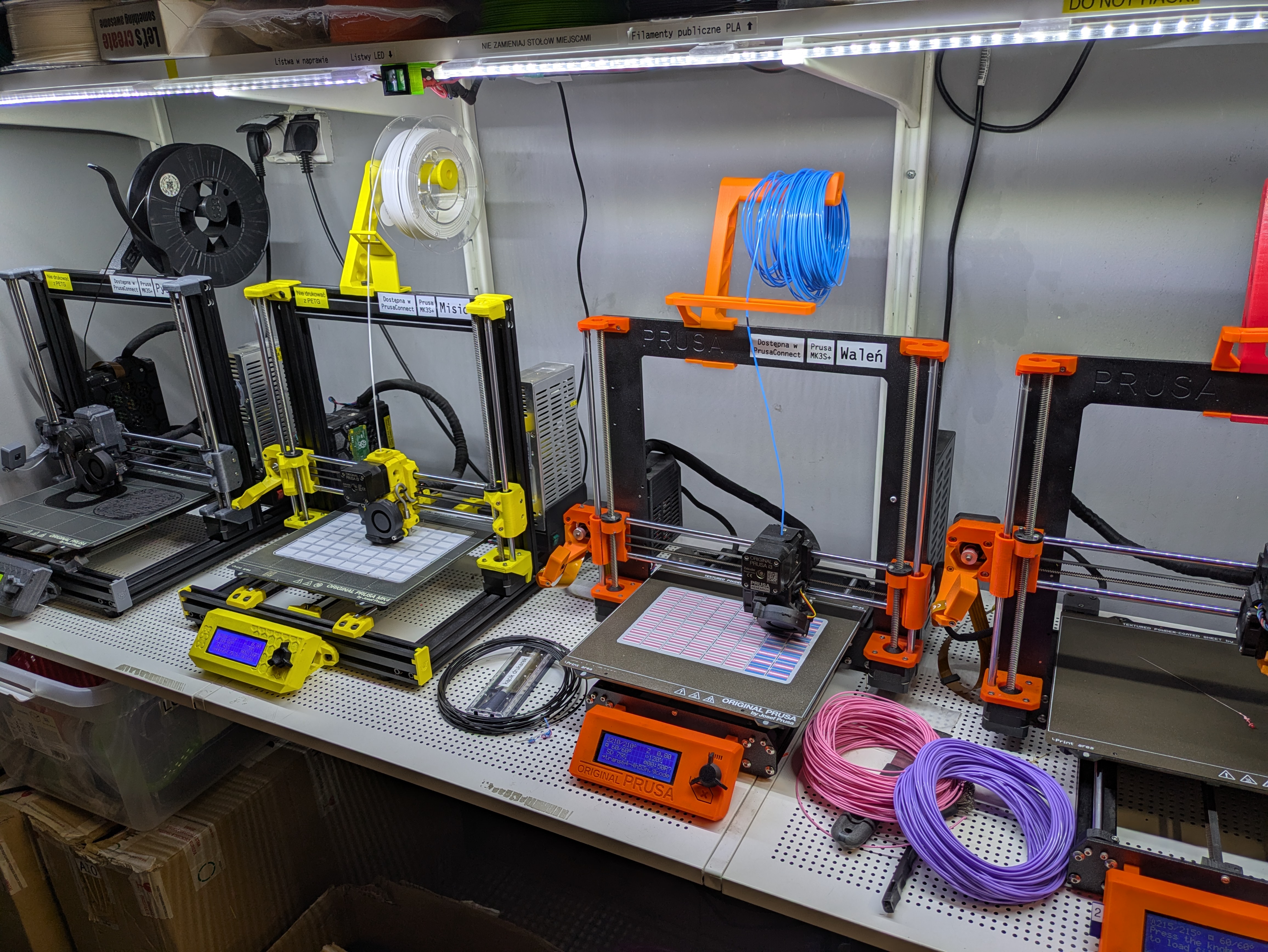 two 3d printers making 64 flags each at once